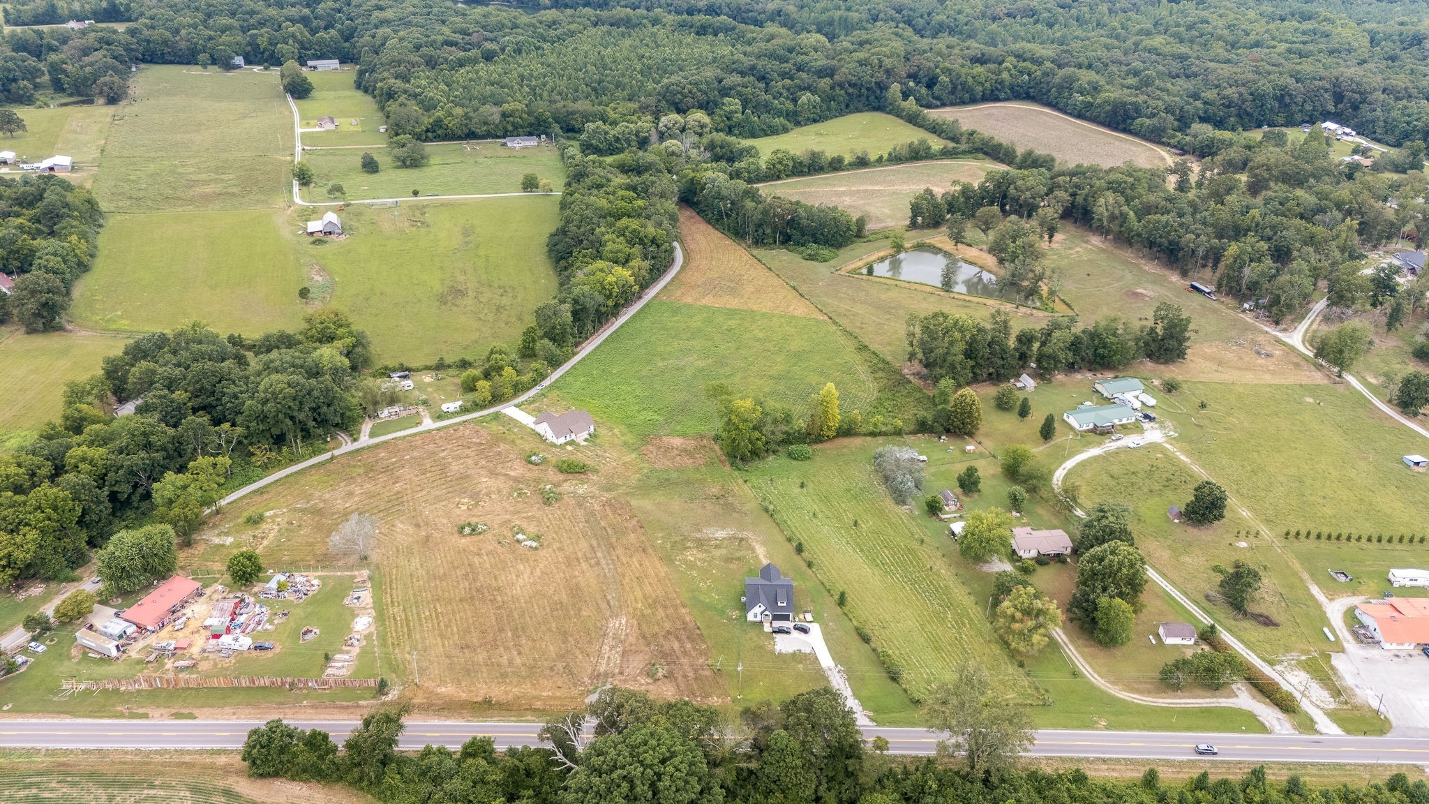 0 Aedc Road Estill Springs, TN 37330 - Photo 5 of 8 an aerial view of a house with a yard and greenery