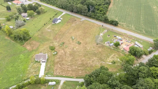 an aerial view of a house with a lake view