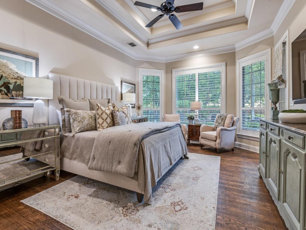 701 Regency Court Denton, TX 76210 - Photo 17 of 39 a spacious bedroom with a bed a couch and a large window