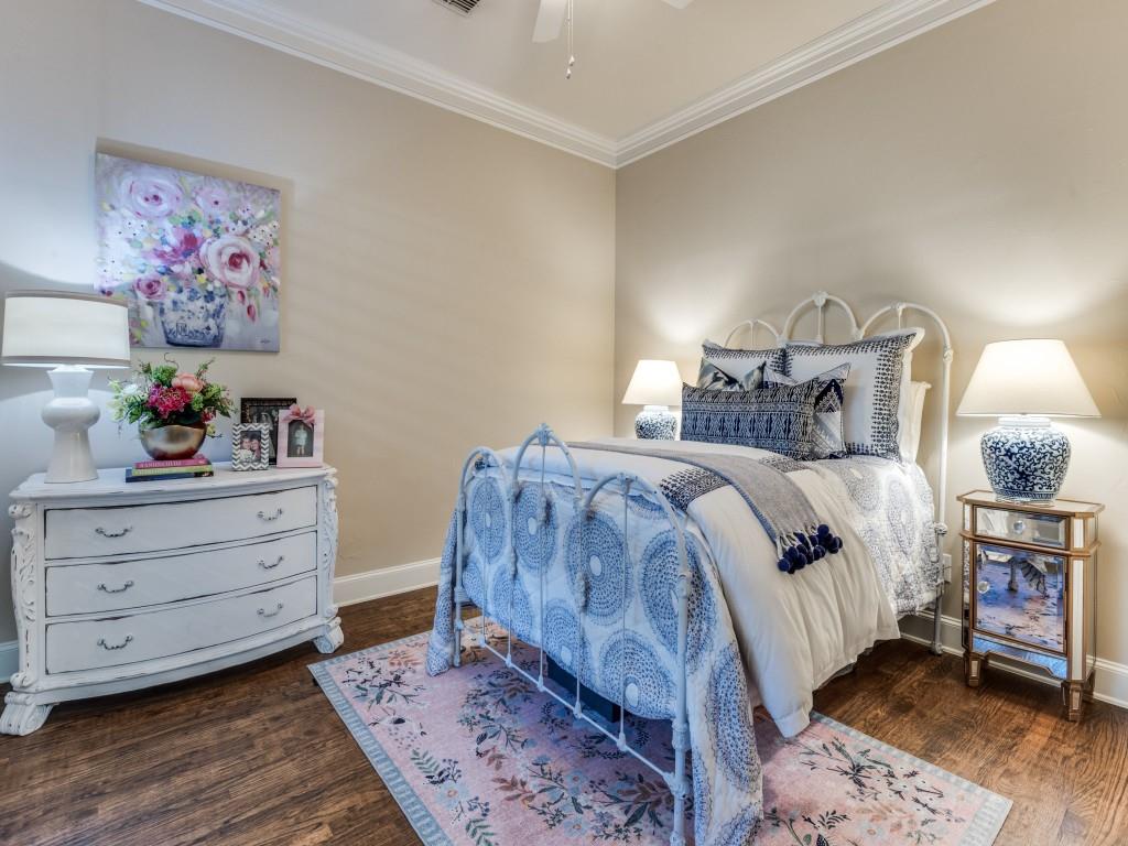 701 Regency Court Denton, TX 76210 - Photo 22 of 39 a bedroom with a bed and a painting on the wall