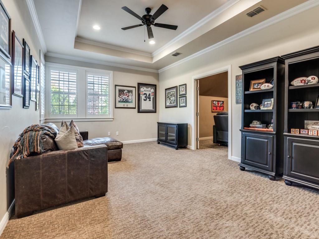 701 Regency Court Denton, TX 76210 - Photo 28 of 39 a living room with furniture and a fireplace