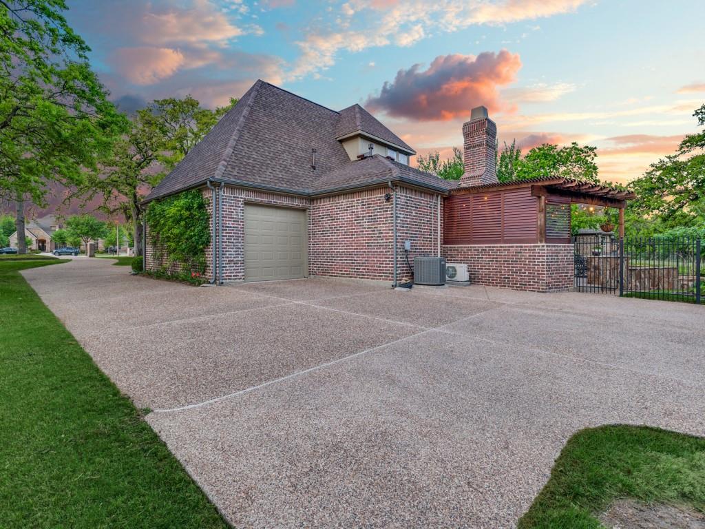 701 Regency Court Denton, TX 76210 - Photo 37 of 39 a view of a house with a yard and large tree