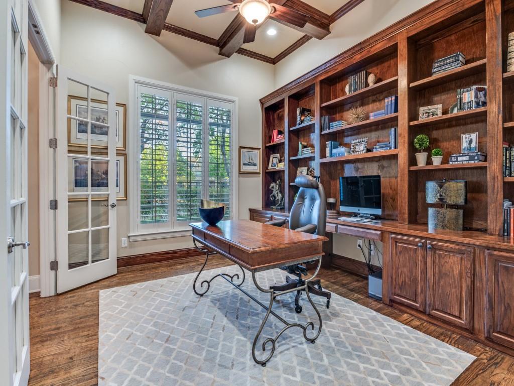 701 Regency Court Denton, TX 76210 - Photo 5 of 39 a view of a workspace with furniture and a bookshelf