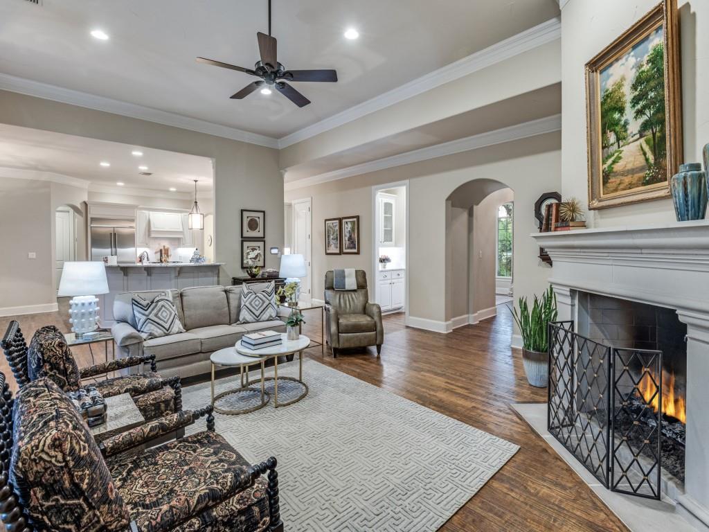 701 Regency Court Denton, TX 76210 - Photo 9 of 39 a living room with furniture and a fireplace