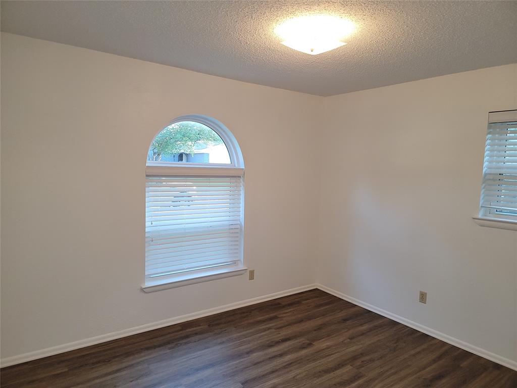 1000 Springdale Road Bedford, TX 76021 - Photo 27 of 36 Enjoy added natural light through the arched window and additional side window.