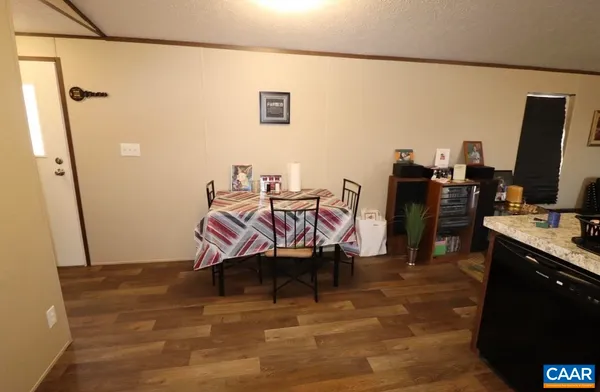 a room with furniture and wooden floor