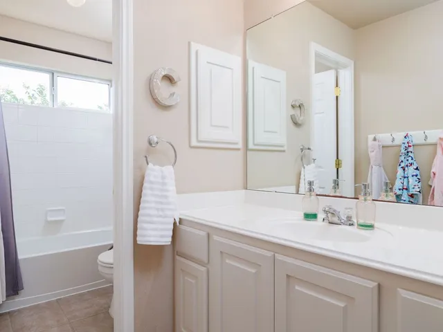 a spacious bedroom with a bed and a couch