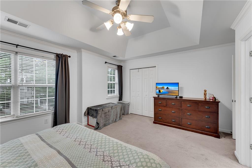 1791 Heights Circle Kennesaw, GA 30152 - Photo 15 of 24 a bedroom with a bed and a dresser