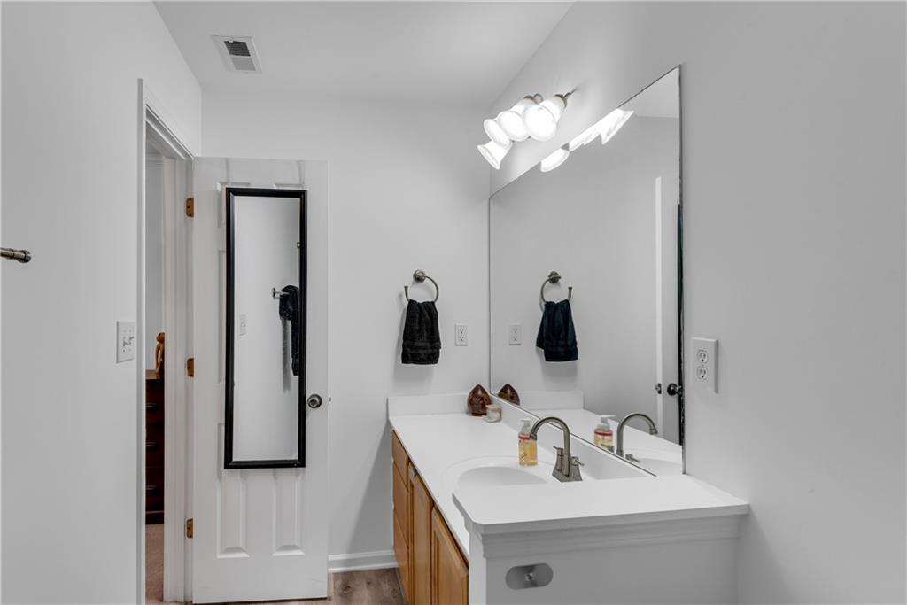 1791 Heights Circle Kennesaw, GA 30152 - Photo 17 of 24 a bathroom with a sink and a mirror