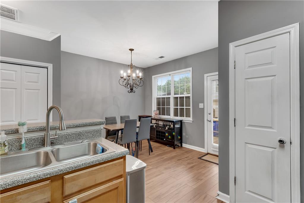 1791 Heights Circle Kennesaw, GA 30152 - Photo 10 of 24 a kitchen with sink refrigerator and window