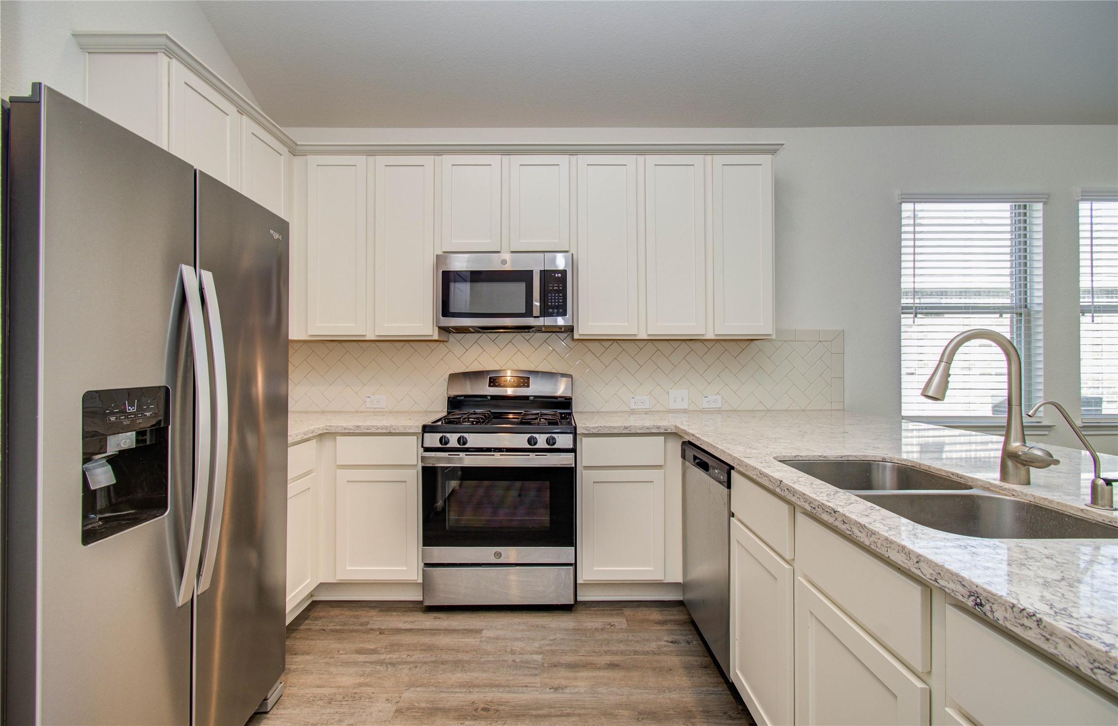 8426 Beacon Bay Circle Baytown, TX 77523 - Photo 11 of 36 a kitchen with stainless steel appliances granite countertop a refrigerator stove and sink