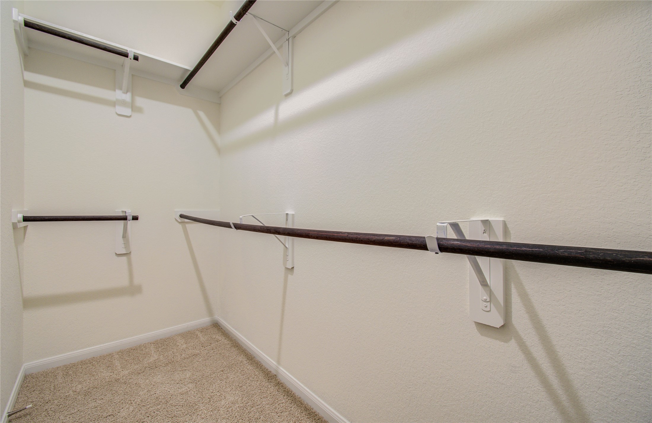 8426 Beacon Bay Circle Baytown, TX 77523 - Photo 24 of 36 a view of walk in closet with empty racks