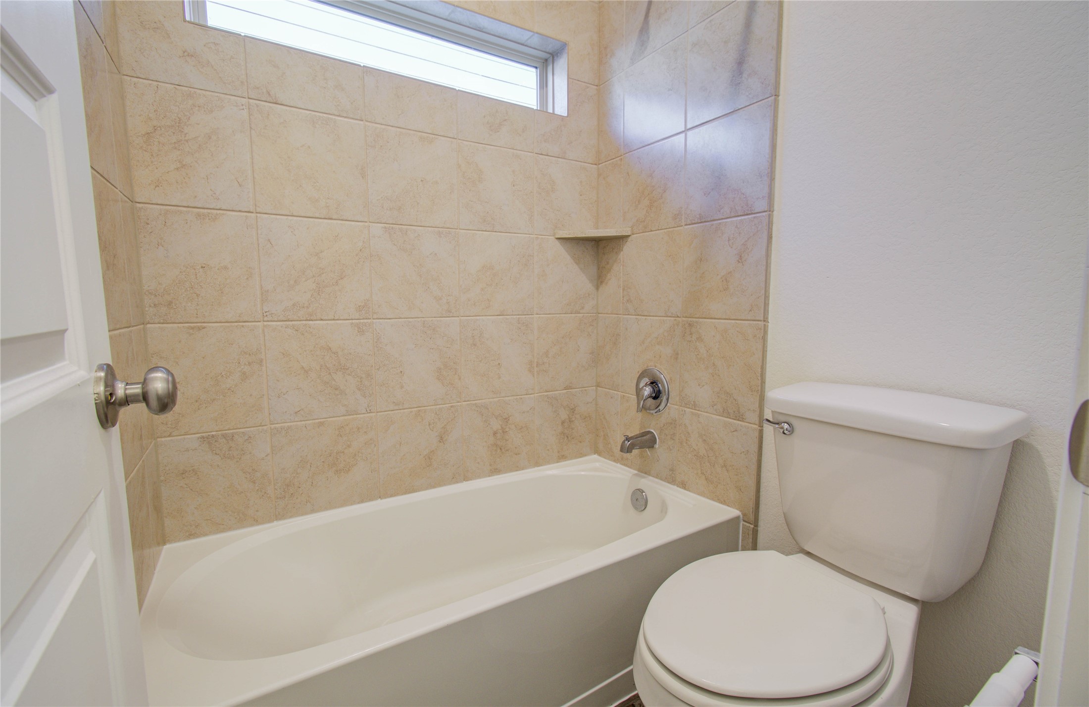 8426 Beacon Bay Circle Baytown, TX 77523 - Photo 28 of 36 a white toilet and tub sitting next to a bathroom sink