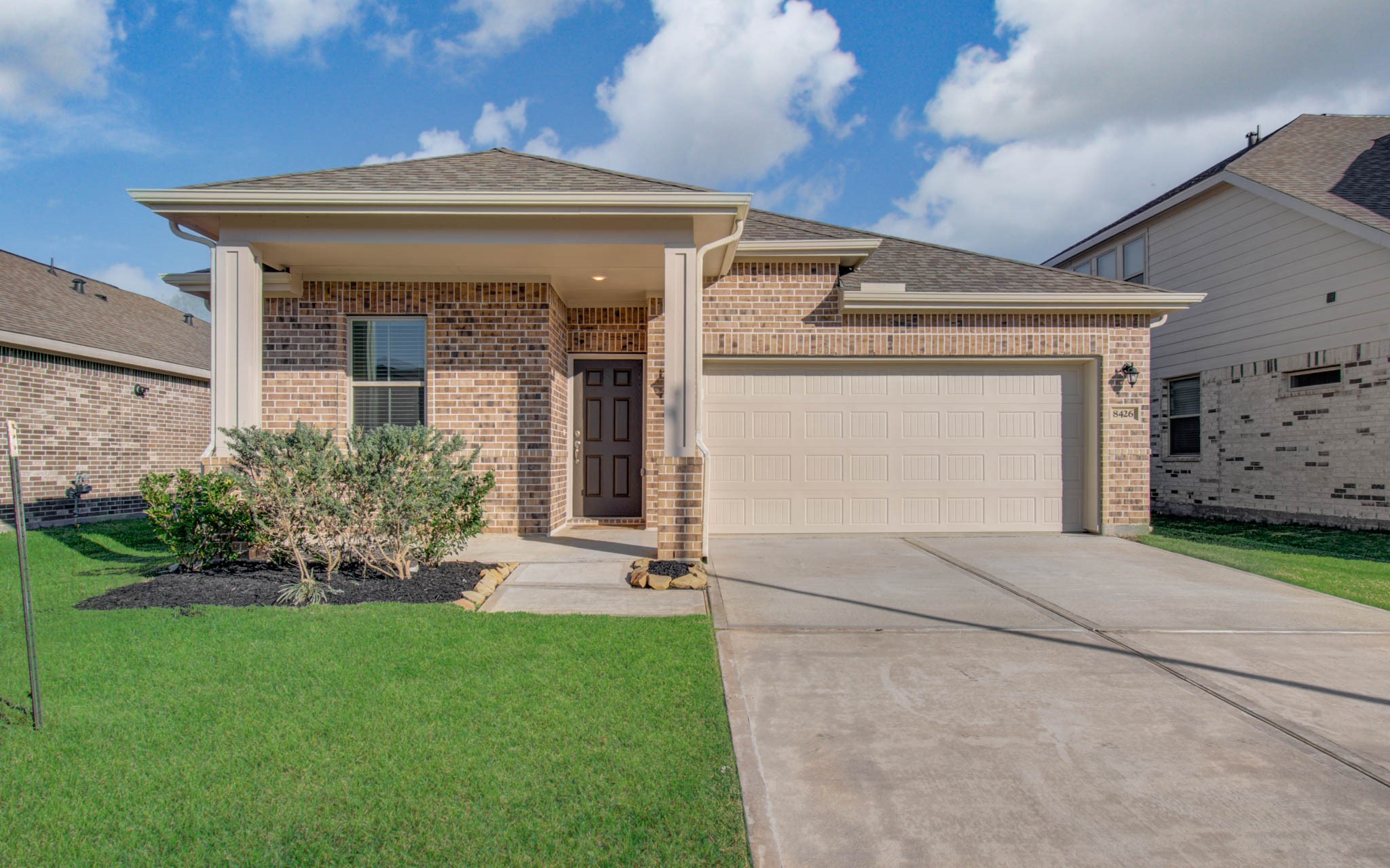 8426 Beacon Bay Circle Baytown, TX 77523 - Photo 4 of 36 a front view of a house with a yard and garage