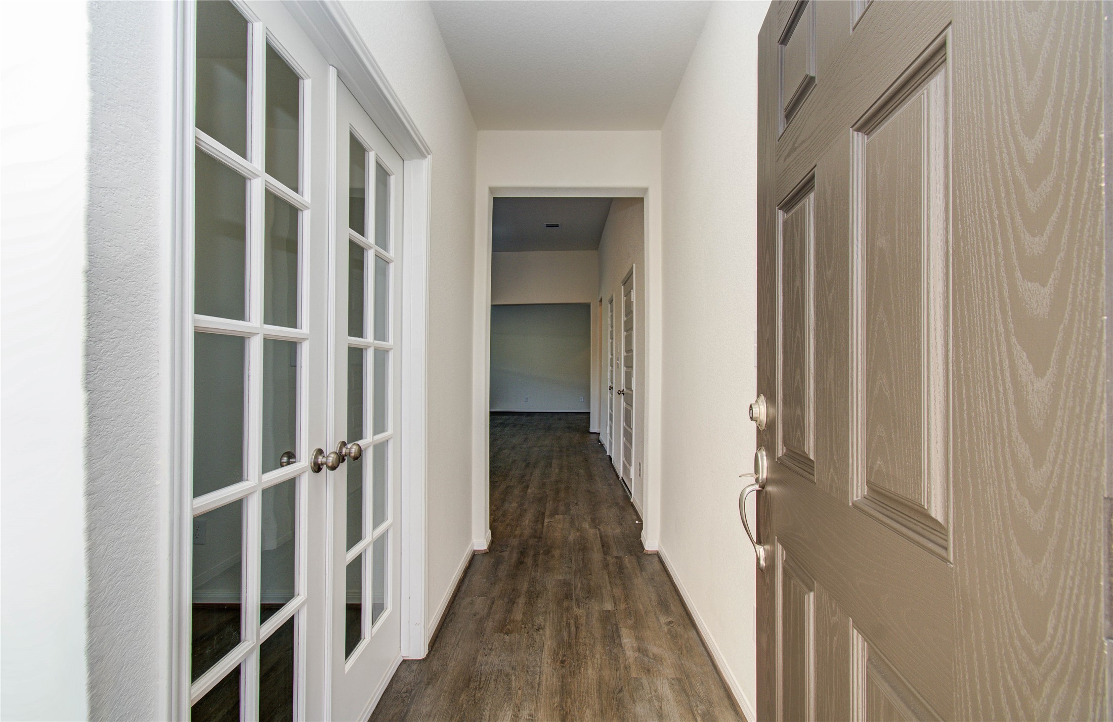 8426 Beacon Bay Circle Baytown, TX 77523 - Photo 5 of 36 a view of a hallway with wooden floor and staircase