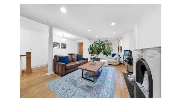 a picture of a room with a white wall and picture