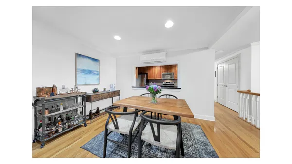 a living room with furniture a fireplace and a rug