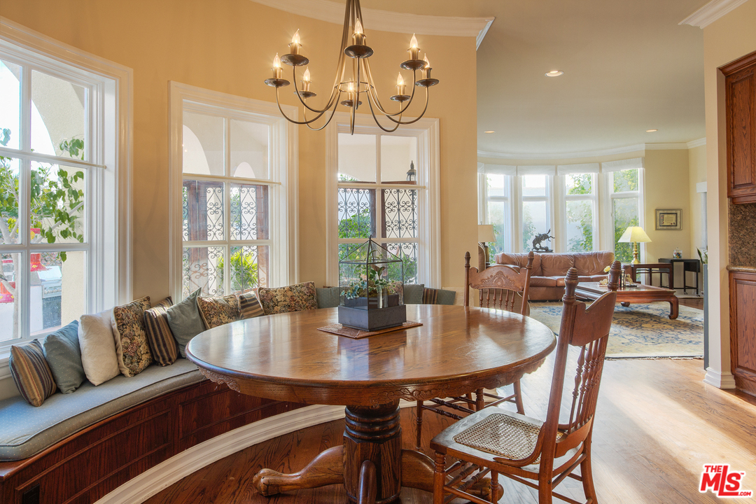 340 11th Street Santa Monica, CA 90402 - Photo 13 of 28 a view of a dining room with furniture wooden floor and chandelier