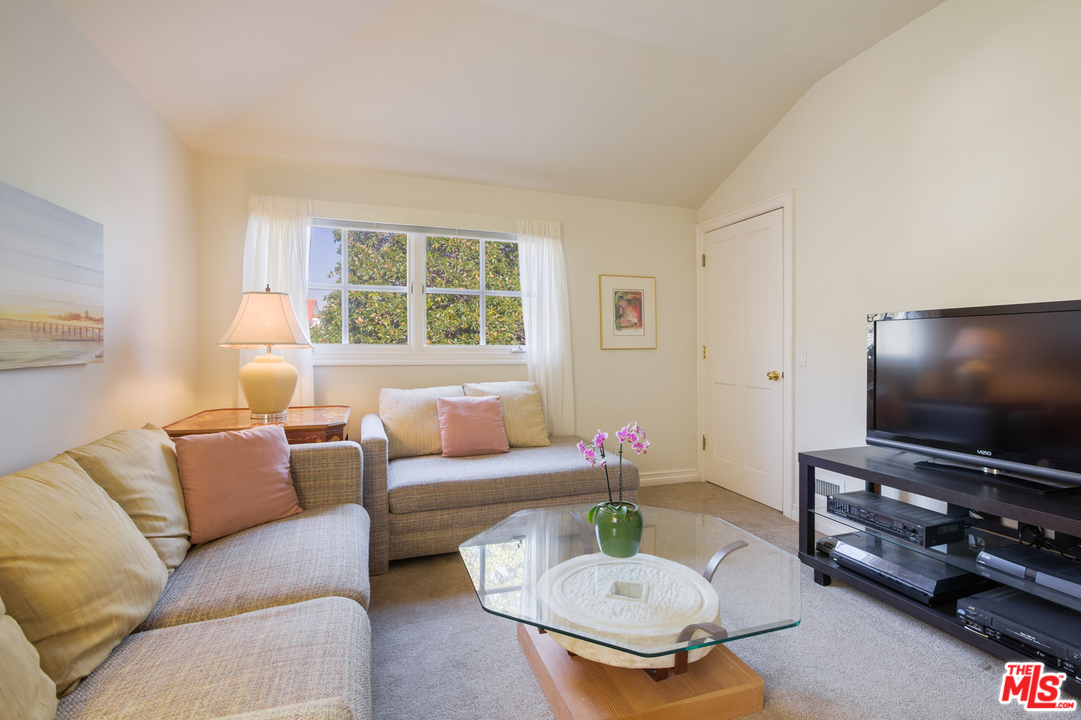 340 11th Street Santa Monica, CA 90402 - Photo 16 of 28 a living room with furniture and a flat screen tv