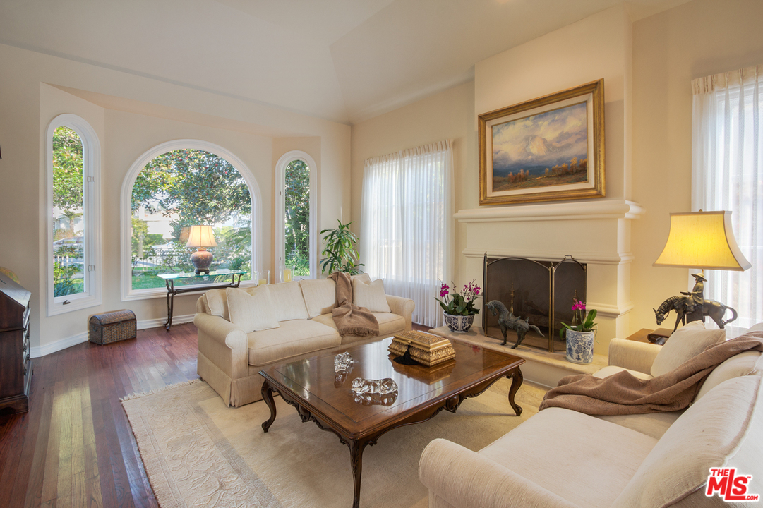 340 11th Street Santa Monica, CA 90402 - Photo 6 of 28 a living room with furniture a fireplace and a large window
