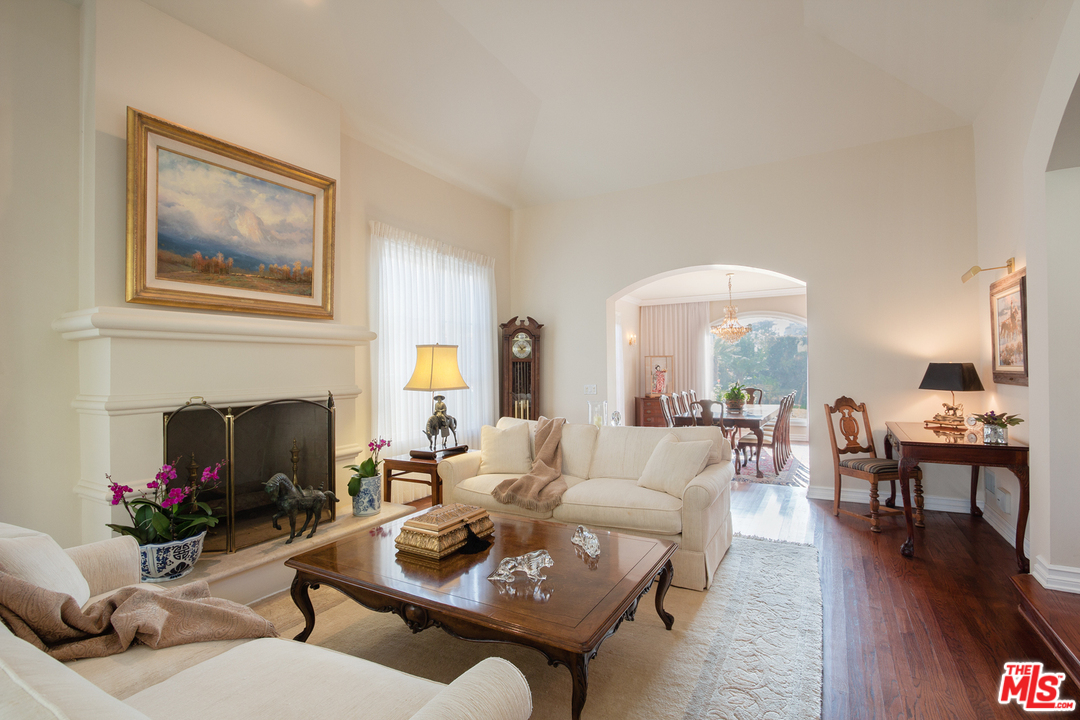 340 11th Street Santa Monica, CA 90402 - Photo 8 of 28 a living room with furniture a fireplace and a potted plant
