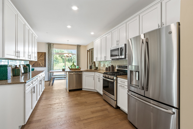 2021 Stuttle Road Batavia, IL 60510 - Photo 11 of 27 a kitchen with granite countertop a refrigerator stove top oven and sink