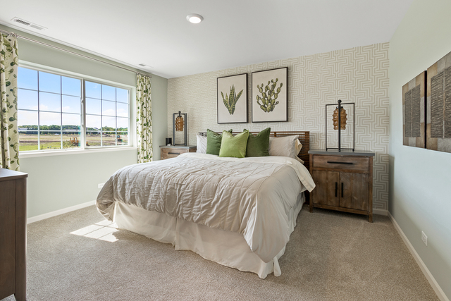 2021 Stuttle Road Batavia, IL 60510 - Photo 19 of 27 a spacious bedroom with a bed and a large window