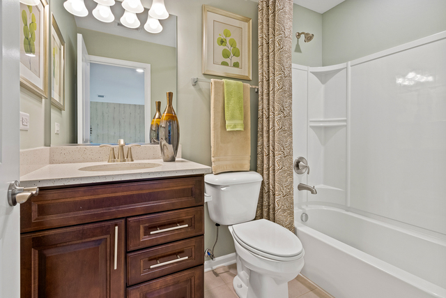 2021 Stuttle Road Batavia, IL 60510 - Photo 23 of 27 a bathroom with a sink a toilet and shower