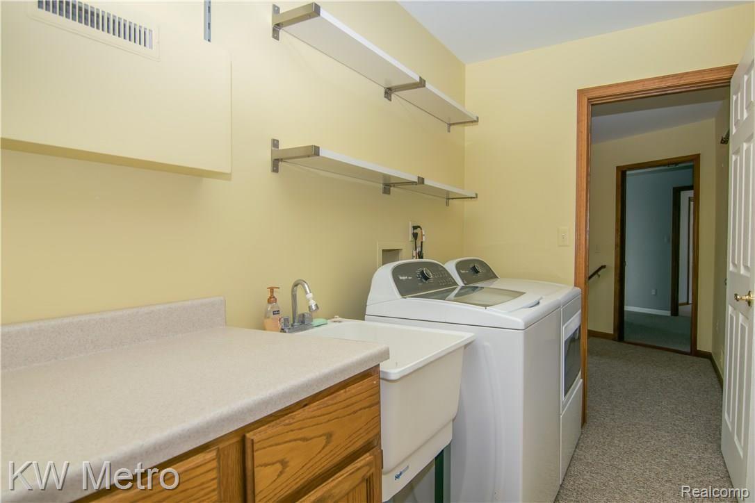 2211 West Wardlow Road Highland, MI 48357 - Photo 25 of 53 Entry level Laundry room.