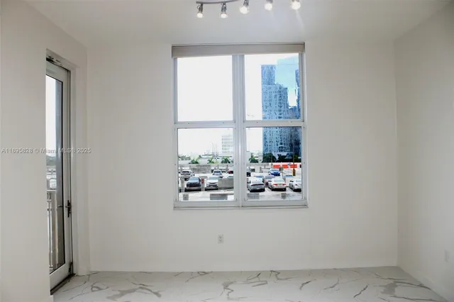 a view of a livingroom with wooden floor