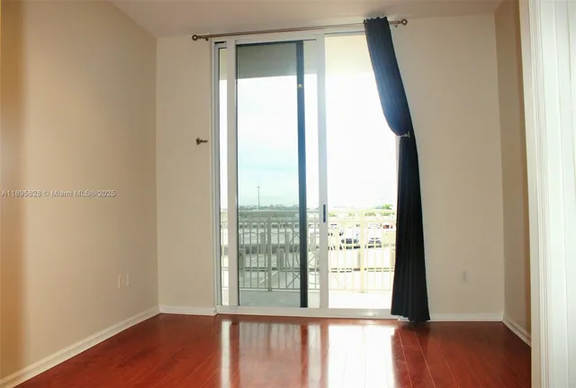 a view of a chair and tables in the back yard of the house