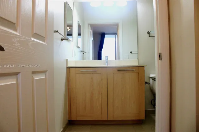 a view of a patio with couches table and chairs and potted plants