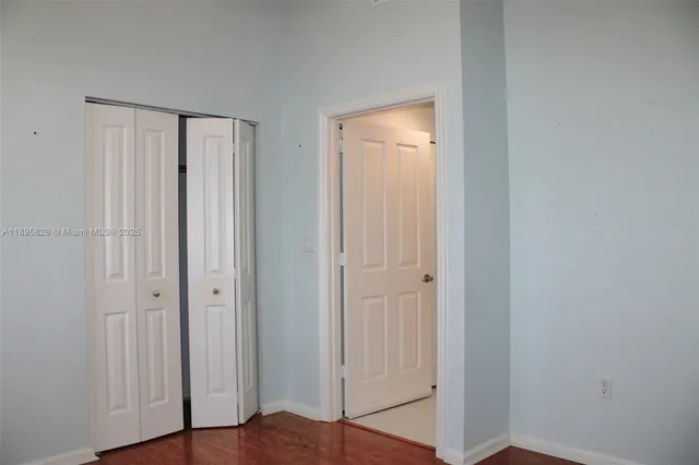 a view of a patio with plants and lake view