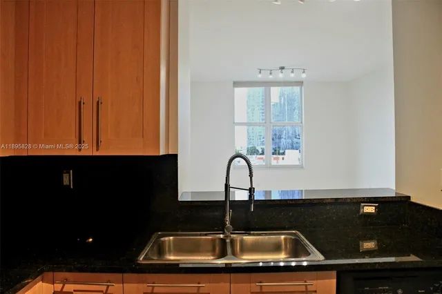 a bathroom with a sink toilet and mirror