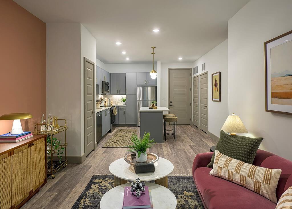 7260 Roswell Road, Unit S1 Sandy Springs, GA 30328 - Photo 21 of 23 a living room with furniture kitchen view and a wooden floor