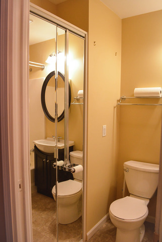 53 Sierra Road Montgomery, IL 60538 - Photo 11 of 25 a bathroom with a toilet a sink and a mirror
