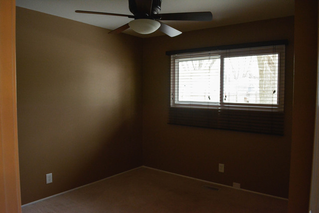 53 Sierra Road Montgomery, IL 60538 - Photo 17 of 25 an empty room with a window