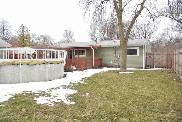 53 Sierra Road Montgomery, IL 60538 - Photo 21 of 25 a view of a house with a yard and trees