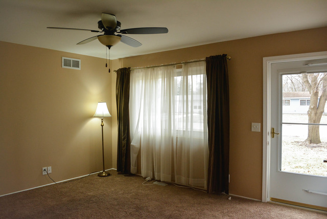 53 Sierra Road Montgomery, IL 60538 - Photo 4 of 25 a view of an empty room with a window
