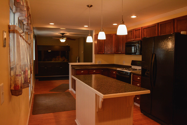 53 Sierra Road Montgomery, IL 60538 - Photo 5 of 25 a kitchen with stainless steel appliances a refrigerator and a sink