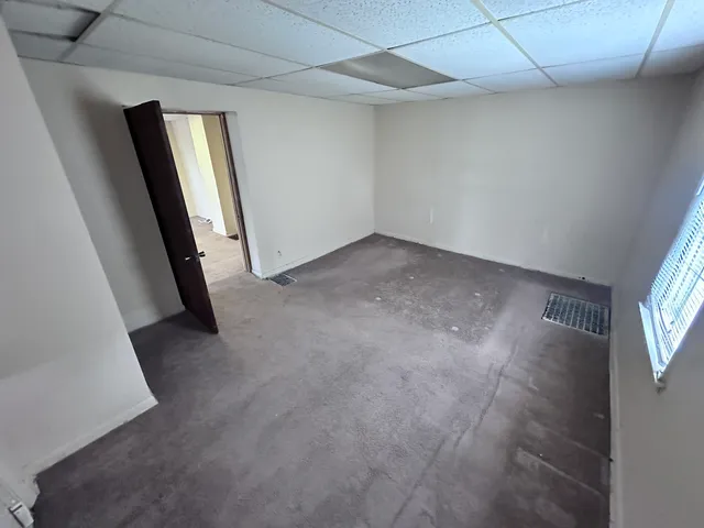 a bathroom with a sink toilet and mirror