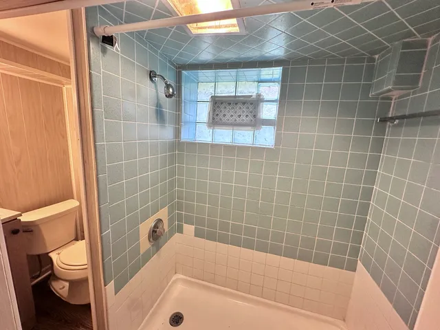 a view of house with a yard