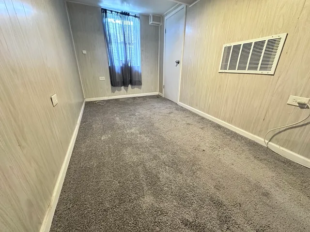 a kitchen with cabinets a sink and wooden floor