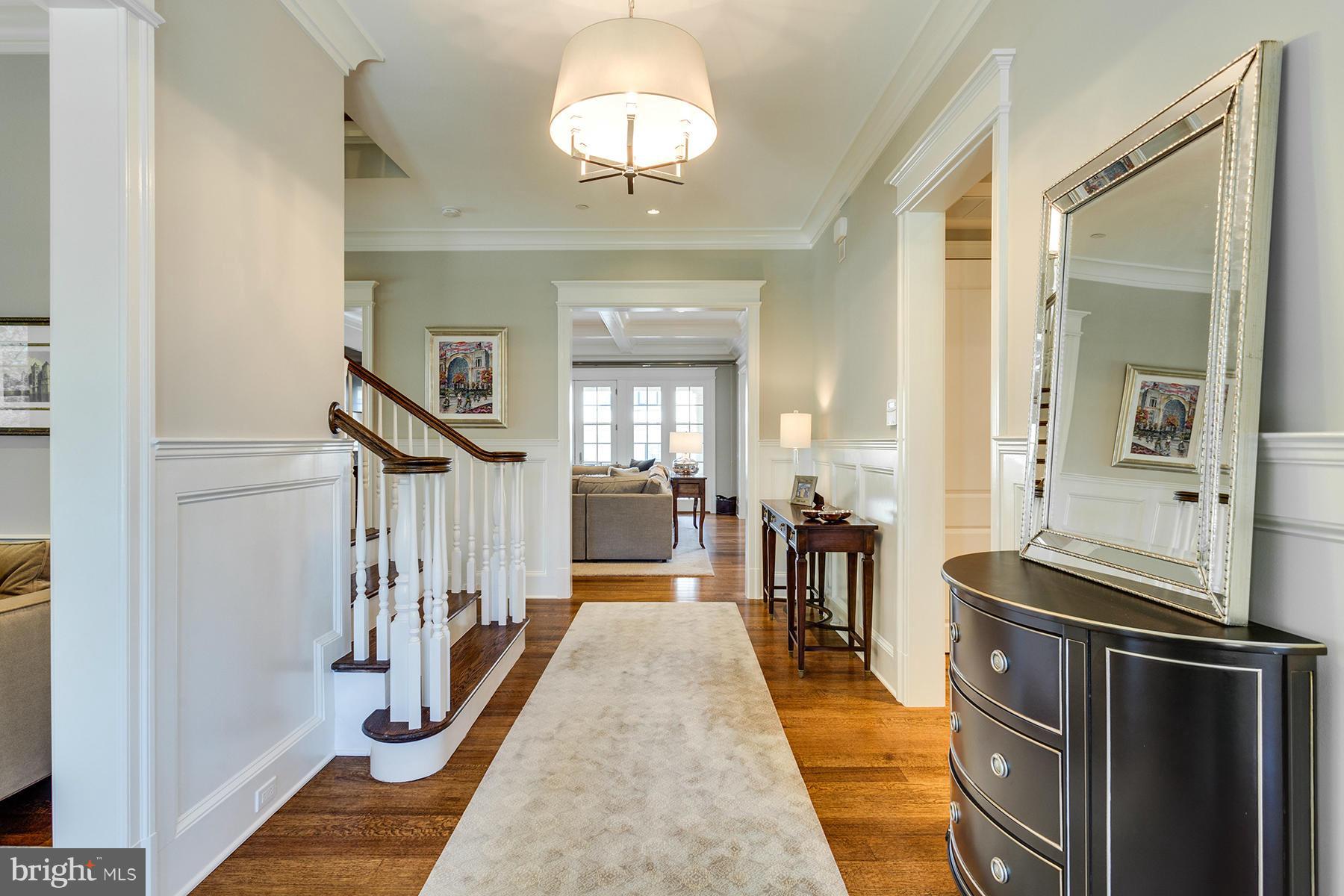 1909 Foxview Circle Northwest Washington, DC 20007 - Photo 2 of 30 a view of a hallway with wooden floor and staircase