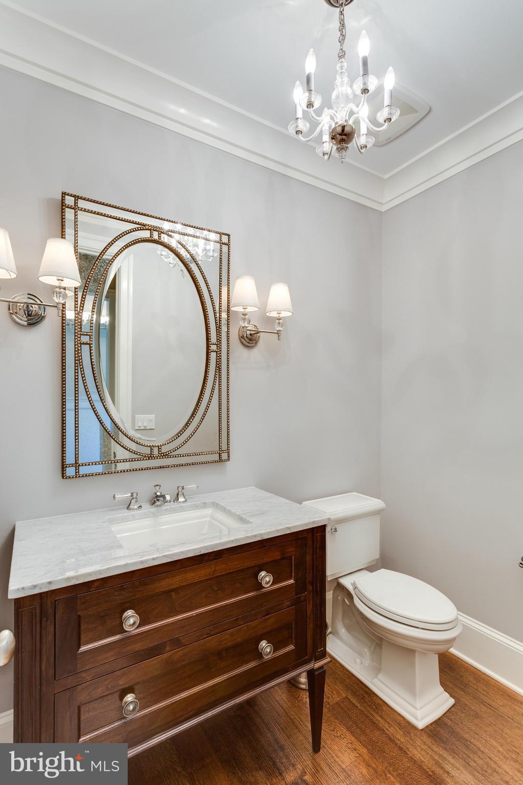 1909 Foxview Circle Northwest Washington, DC 20007 - Photo 14 of 30 a bathroom with a toilet a sink and a mirror