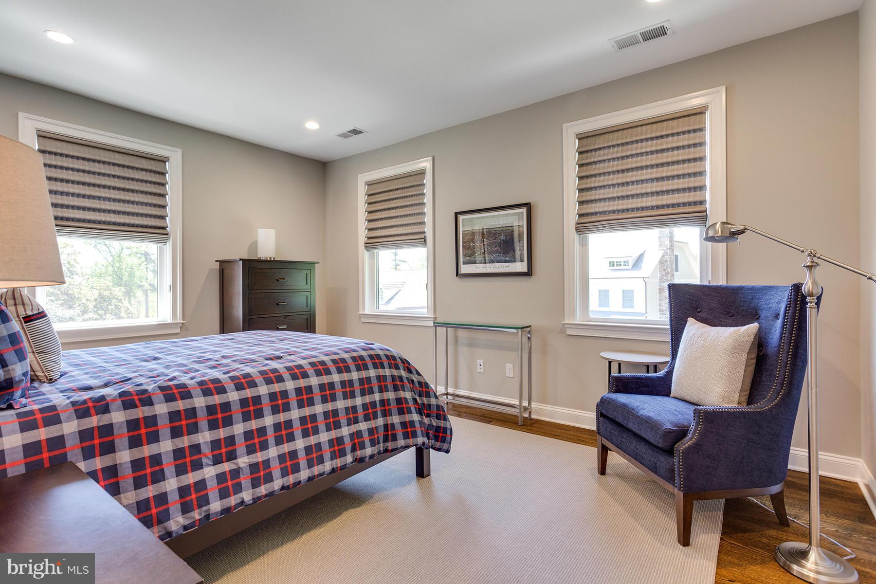 1909 Foxview Circle Northwest Washington, DC 20007 - Photo 19 of 30 a bedroom with a bed and wooden floor