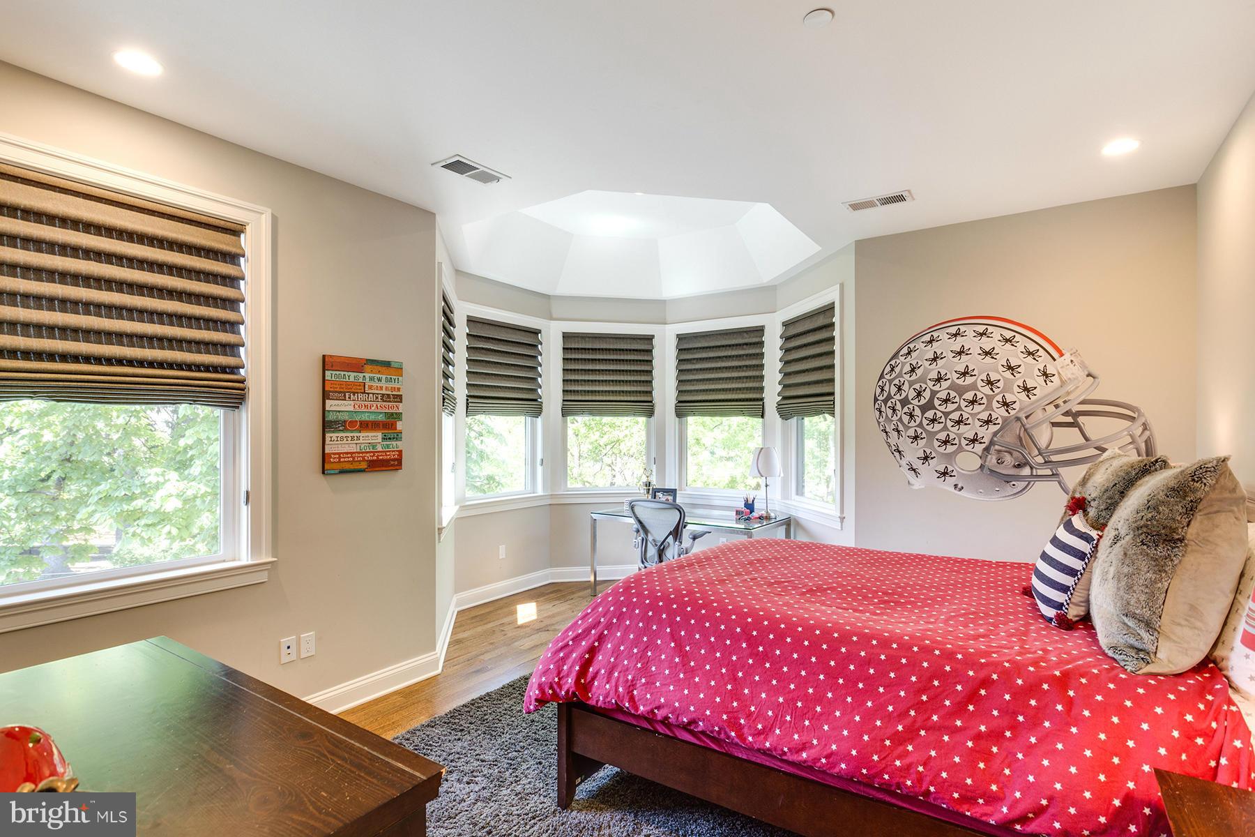 1909 Foxview Circle Northwest Washington, DC 20007 - Photo 20 of 30 a bedroom with a bed and a large window