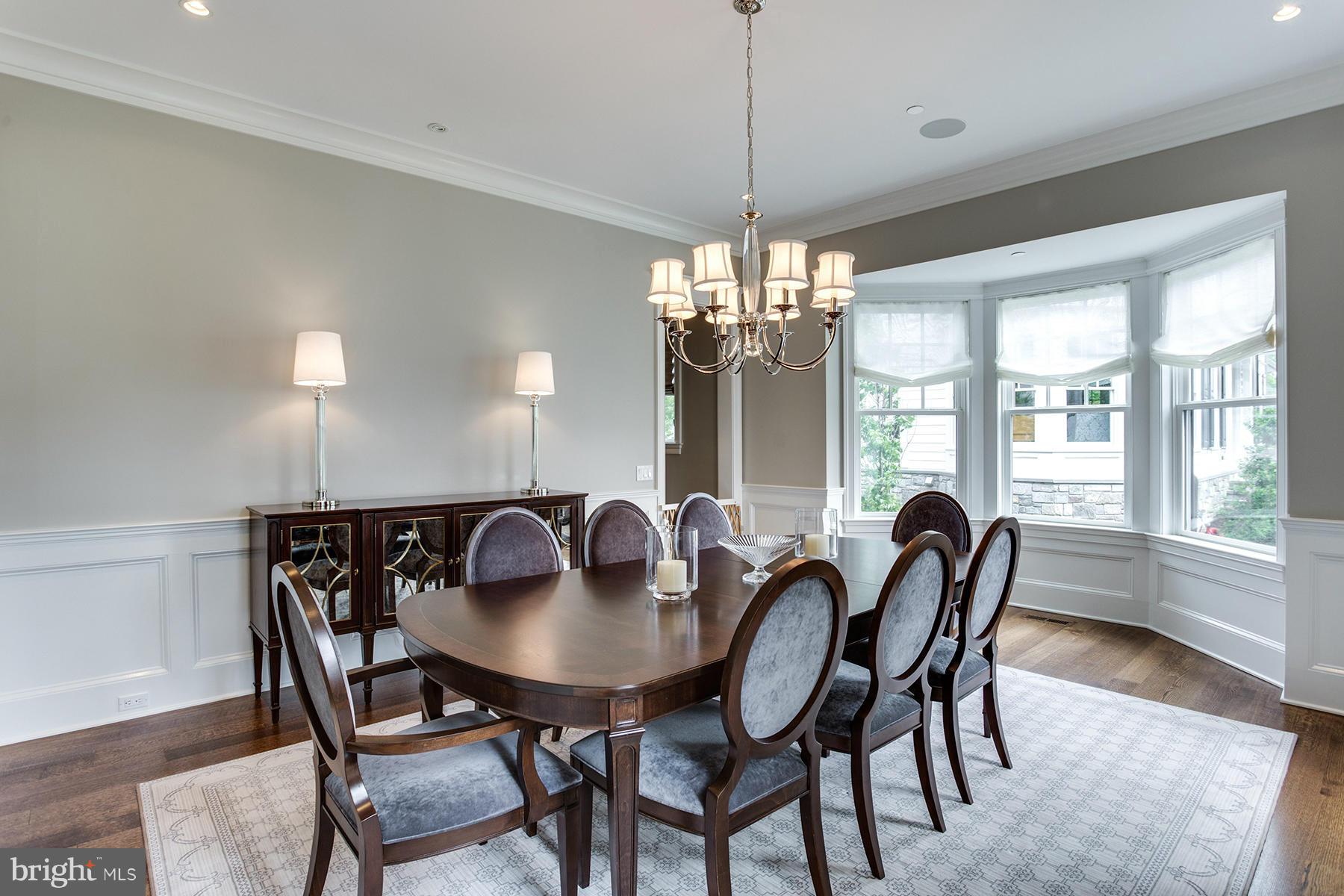 1909 Foxview Circle Northwest Washington, DC 20007 - Photo 6 of 30 a view of a dining room with furniture window and wooden floor