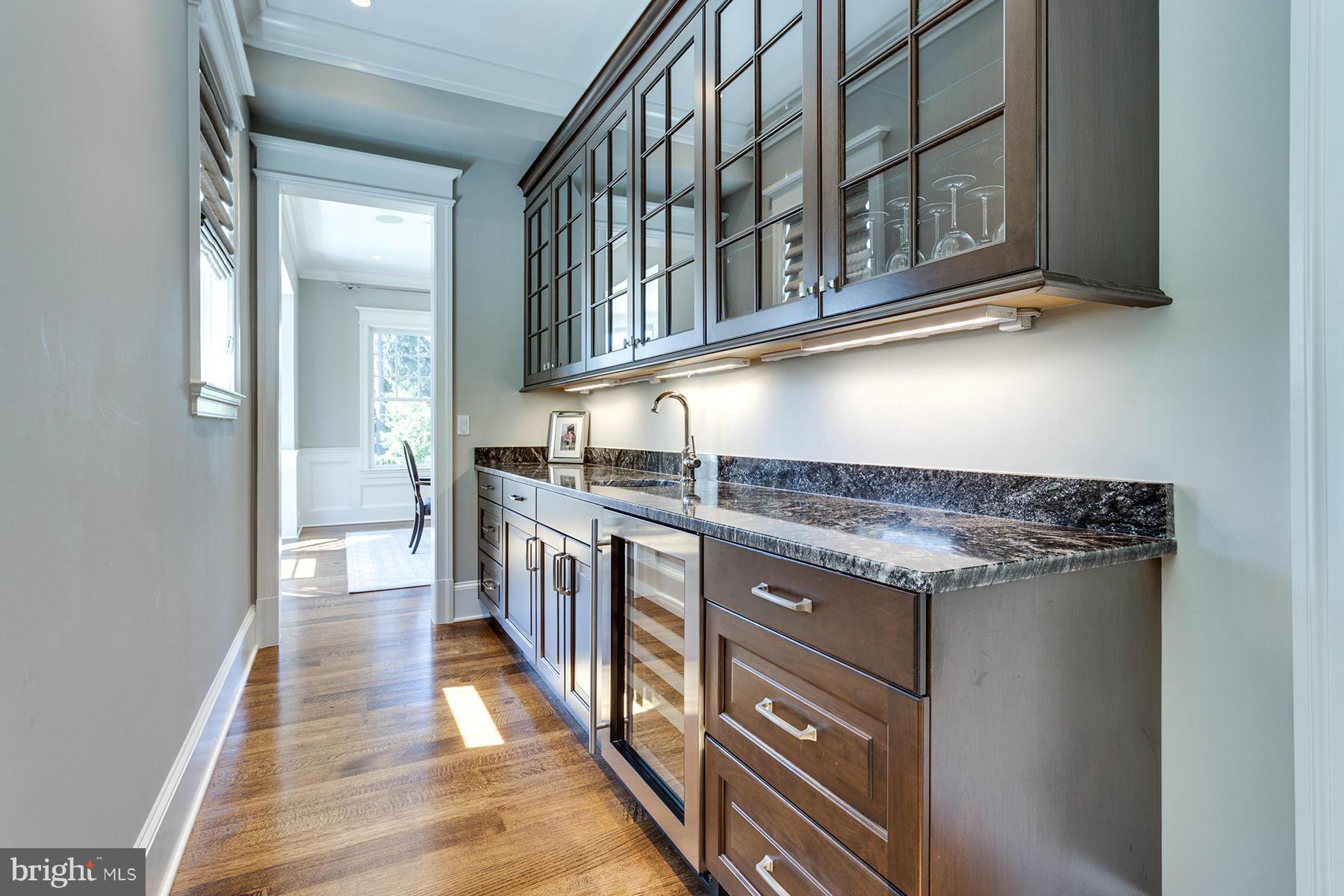 1909 Foxview Circle Northwest Washington, DC 20007 - Photo 7 of 30 a kitchen with stainless steel appliances granite countertop a stove and a sink