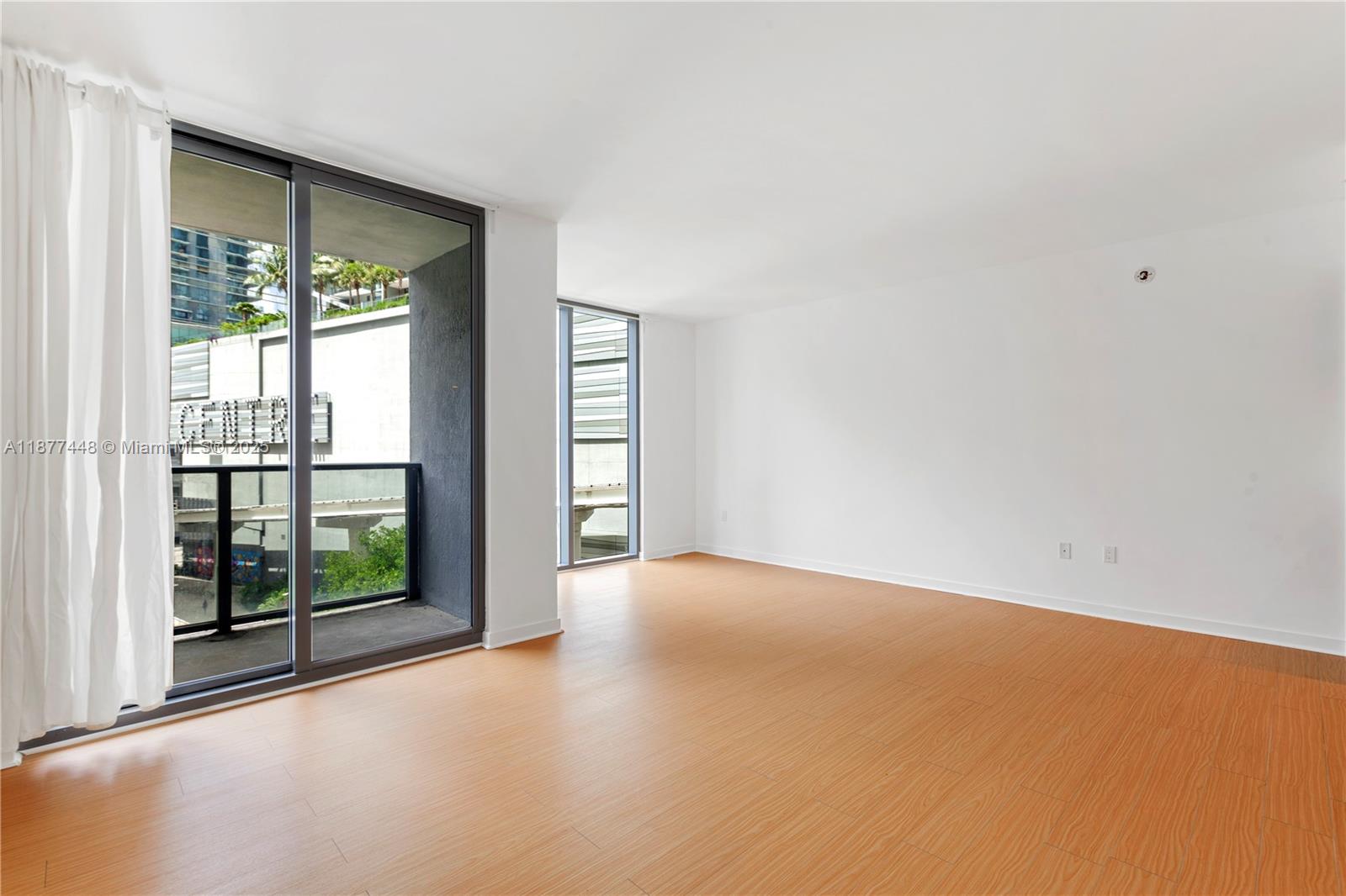 31 Southeast 6th Street, Unit 705 Miami, FL 33131 - Photo 2 of 12 a view of an empty room with a window